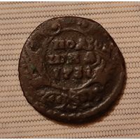 Монета полушка 1731 год перечекан .копейка крестовая Москва.
