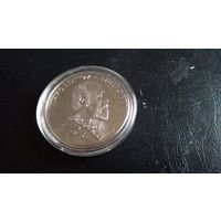 Монетовидный жетон 5 1/2 евро в капсуле.