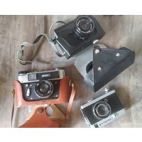 Три фотоаппарата,затворы счелкают,с рубля